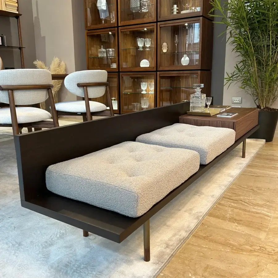 Distinguished Pacini & Cappellini plank bench crafted in solid Canaletto walnut with light gray tufted cushions and reddish-brown metallic legs