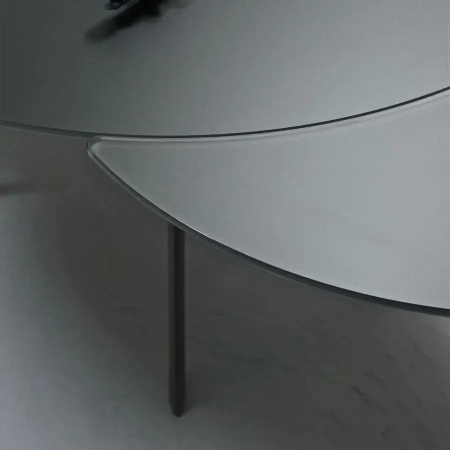 Distinguished Bontempi Giro table with light gray frosted glass tabletop and sleek dark-toned metal legs crafted in Italy