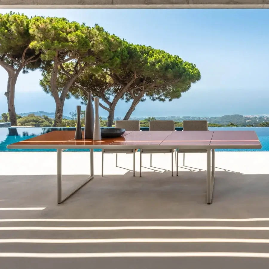 Distinguished Talenti Tressé table with glazed lava stone tabletop and light-colored tubular aluminum legs crafted in Italy
