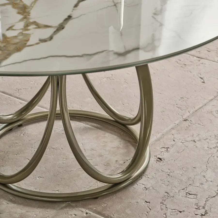 Distinguished Bontempi Louis round table with looping champagne-gold metal supports and a marble-like glass top exhibiting a glossy finish