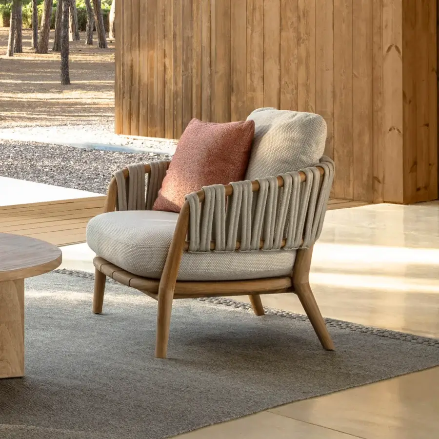 Distinguished Talenti Venice lounge chair with solid teak wood frame and light beige woven textile cushions embellished with neutral gray braided ropes