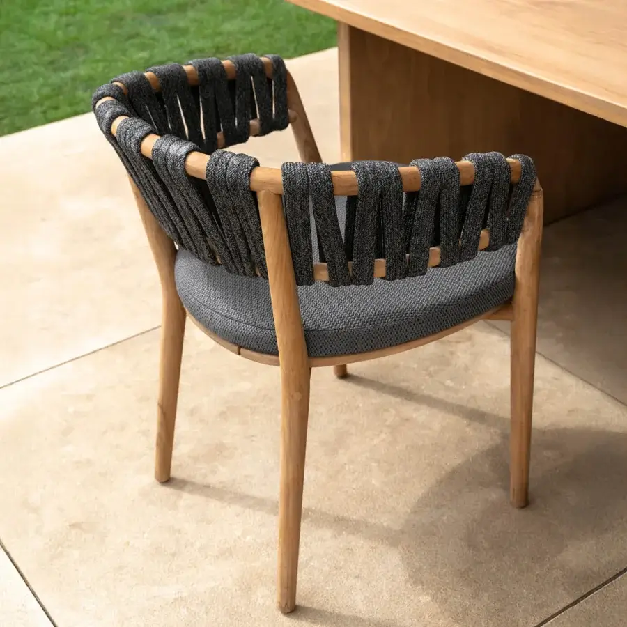 Distinguished Talenti Venice armchair with dark gray upholstery, solid teak wood frame and woven gray rope detailing