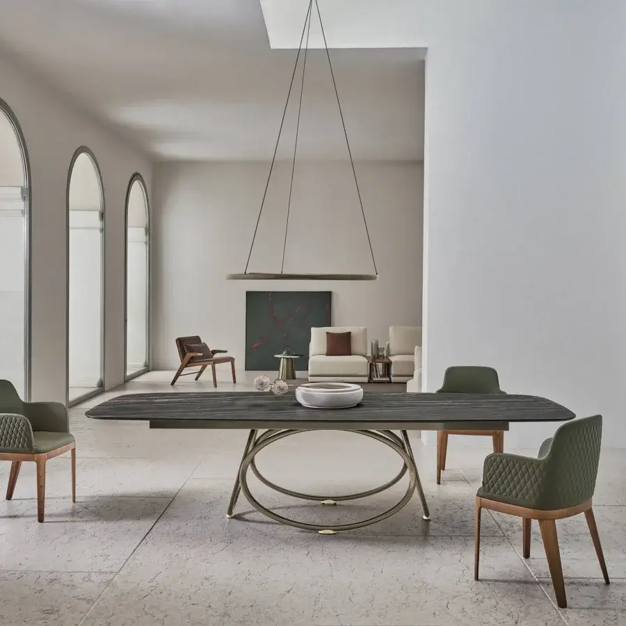 Distinguished Bontempi Louis Barrel table with intersecting oval metal rings and a dark-toned elongated rectangular top
