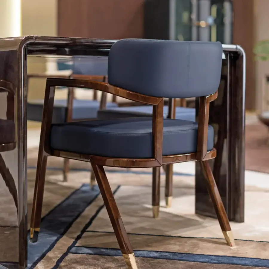 Distinguished Turri Madison table crafted with glossy lacquered dark wood, elegant leather side inserts and a light gold metal accent