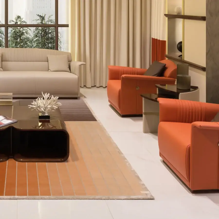 Distinguished Turri Madison lounge chair fully upholstered in orange fabric with vertical stitched detailing and a dark wooden base