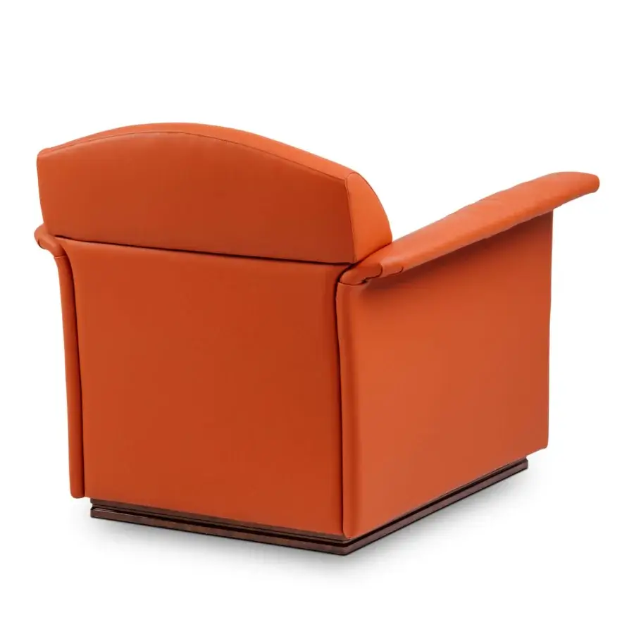 Superior Turri Madison lounge chair upholstered in smooth orange leather with stylish vertical embroidery and dark-toned wooden base