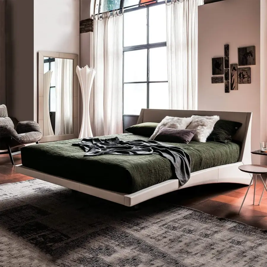Superior Cattelan Italia Dylan bed with curved headboard upholstered in dark green synthetic material and chromed steel feet