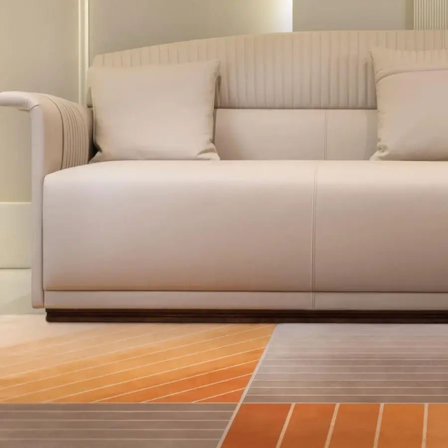 Superior Turri Madison sofa with light cream textile or leather upholstery and stylish vertical embroidery