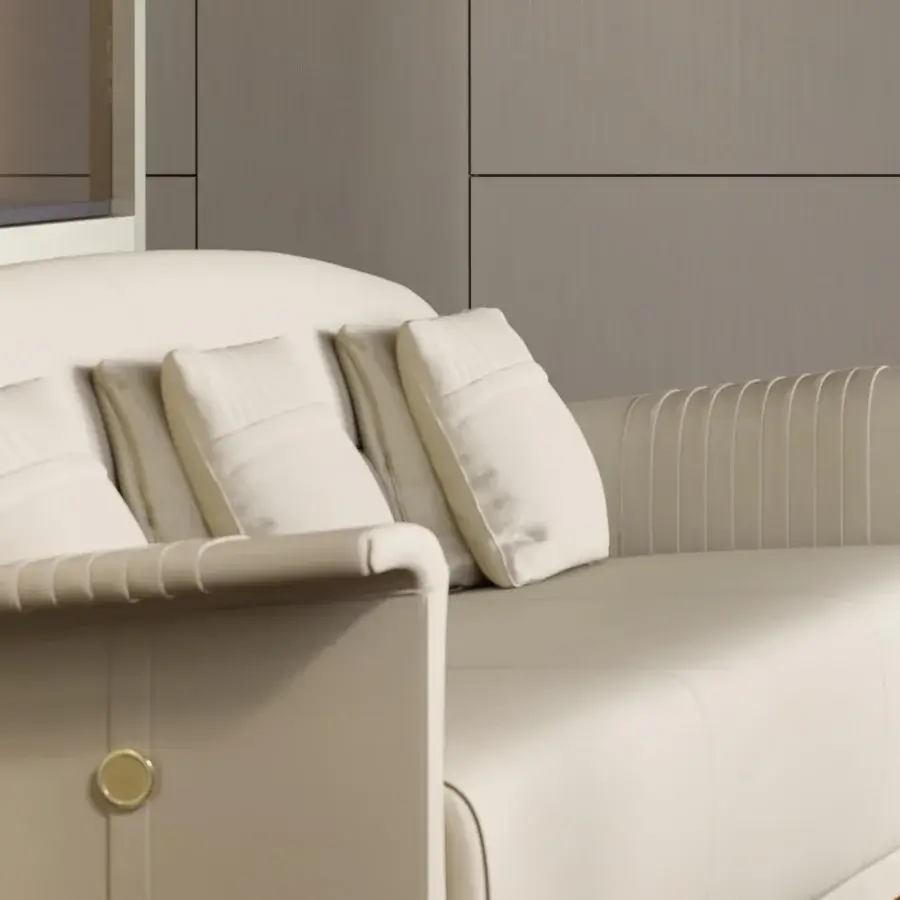 Distinguished Turri Madison sofa with light beige fabric upholstery and gold emblem detailing on armrests