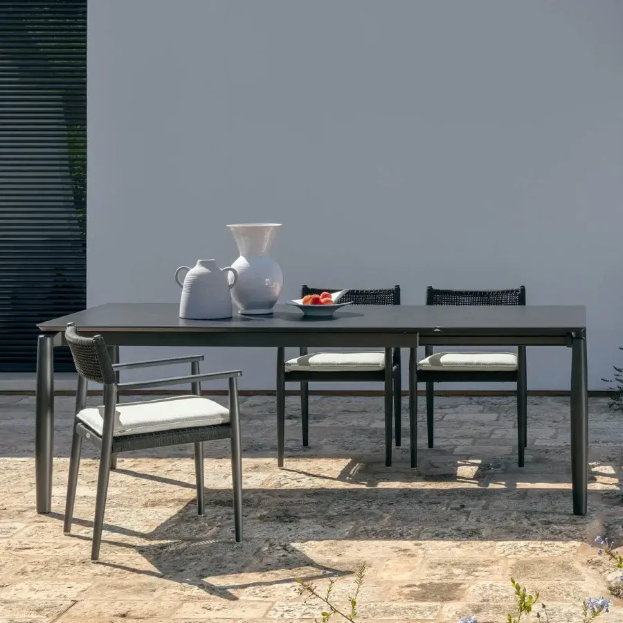 Distinguished Talenti Dolcevita Alu armchair with a woven backrest and comfortable white seat cushion in matte gray metal