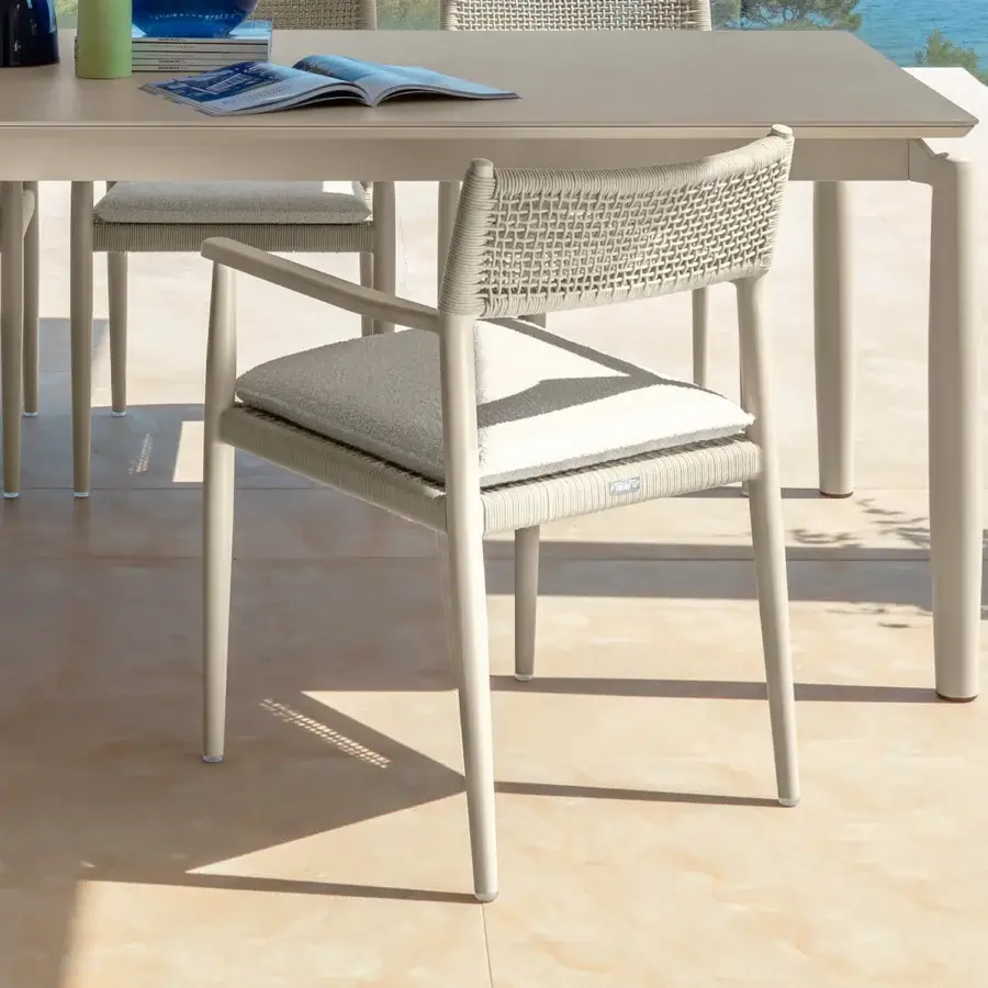 Distinguished Talenti Dolcevita Alu armchair in light beige with woven backrest and plush cushion construction
