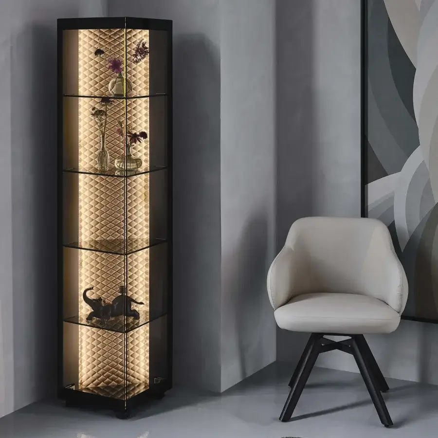 Distinguished Cattelan Italia Atelier showcase with quilted diamond pattern in golden tone and dark frame with clear glass shelves