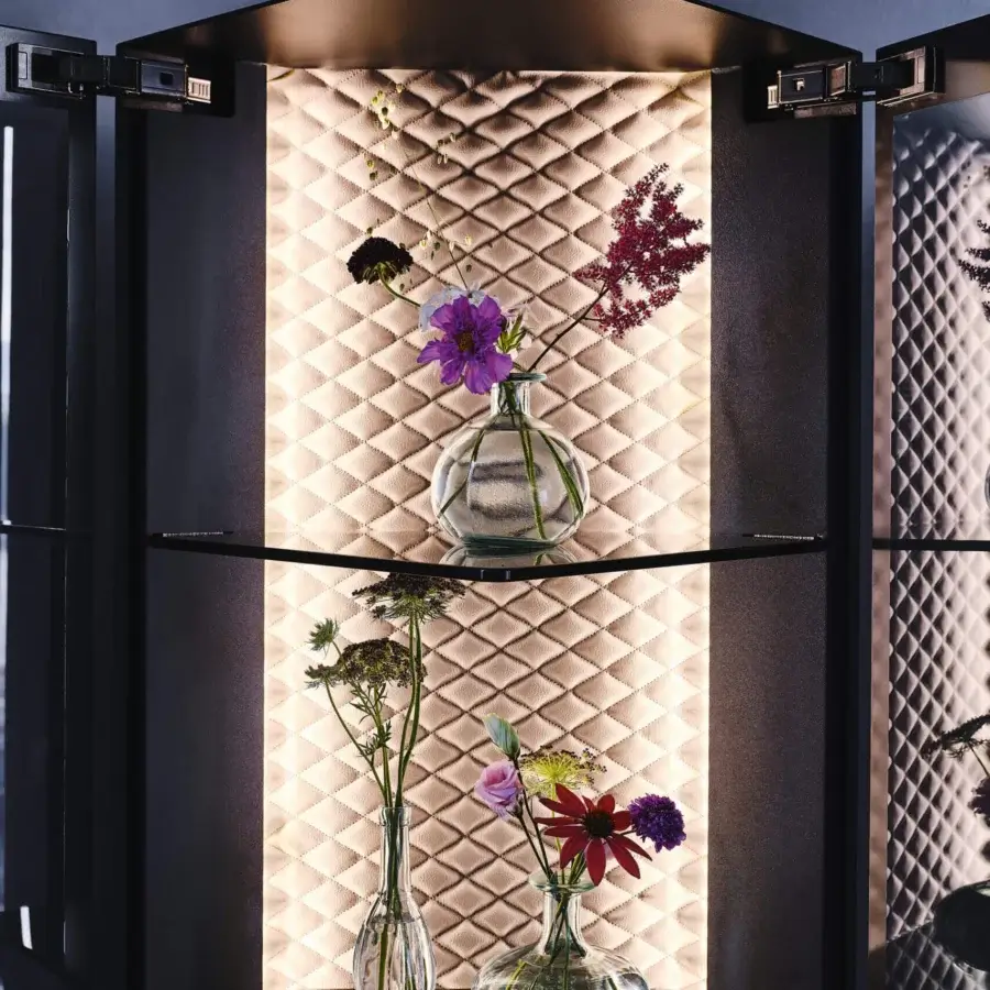Distinguished Cattelan Italia Atelier showcase with smoked glass shelves and light beige quilted synthetic leather back panel