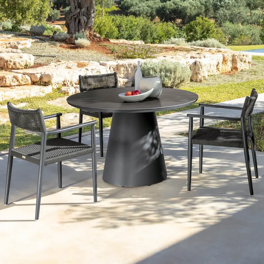 Distinguished Talenti Dolcevita Alu round table with dark gray stoneware top and conical matte aluminum base crafted in Italy