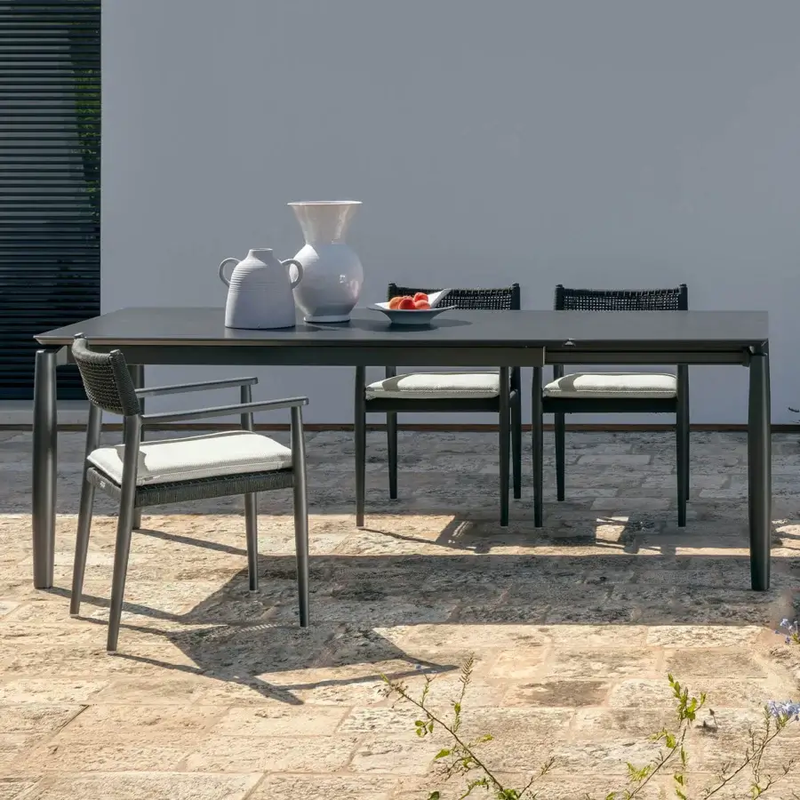 Exceptional Talenti Dolcevita Alu table with extending stoneware top and slender legs crafted for outdoor spaces
