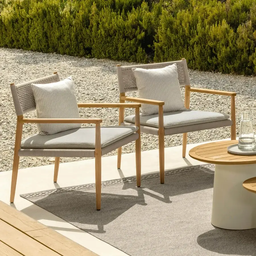 Distinguished Talenti Dolcevita Wood lounge chair with light wood frame and grayish-beige woven strings complemented by gray striped cushions