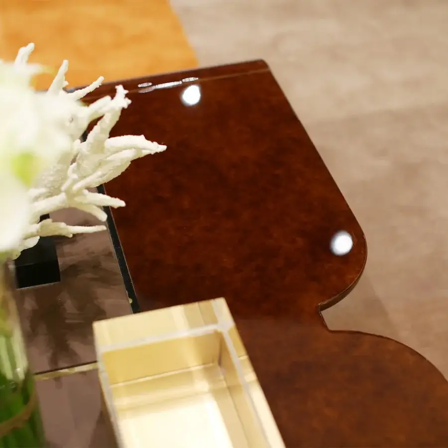 Distinguished Turri Madison coffee table with curved wood, light gold accents and a glossy finish