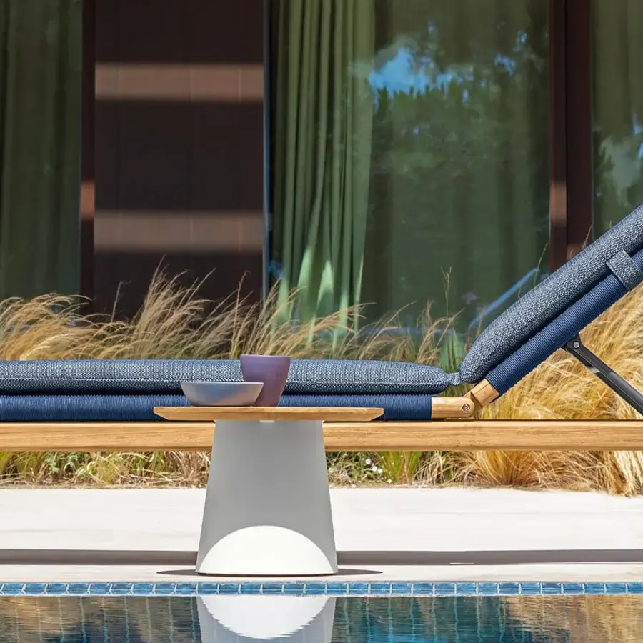 Distinguished Talenti Dolcevita Wood lounger with light brown solid wood and refined woven blue cushions offering mobility with wheels
