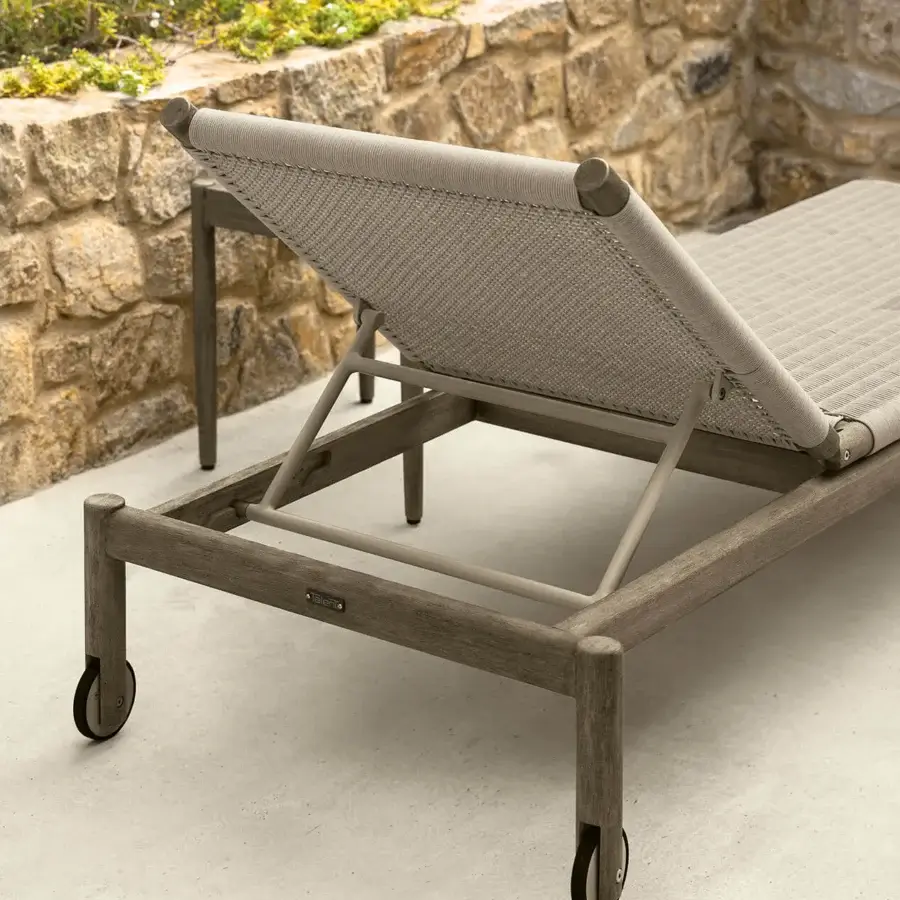 Distinguished Talenti Dolcevita Wood lounger crafted in Italy with a weathered matte gray-brown solid wood structure and woven rope surface