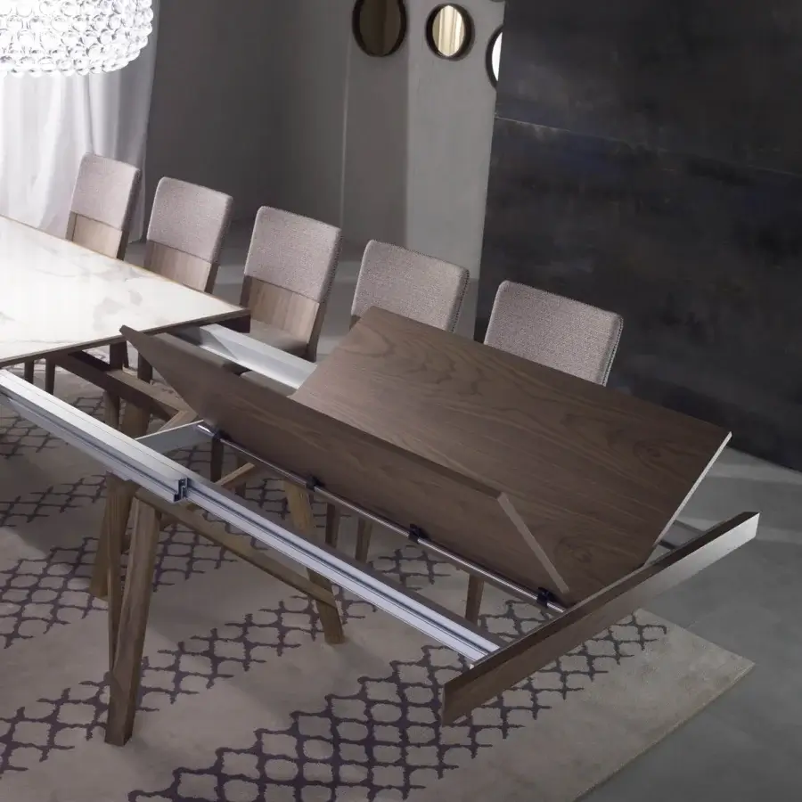 Exceptional Pacini & Cappellini Zeus extendable table with marbled Laminam® ceramic and solid ash angled legs