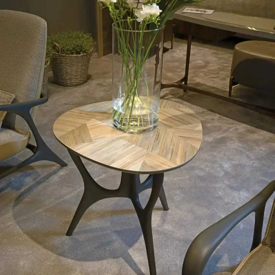 Distinguished BelMondo by Bellotti Ezio Dedalo side table with geometric wood grain in light and medium brown tones and curved wood base