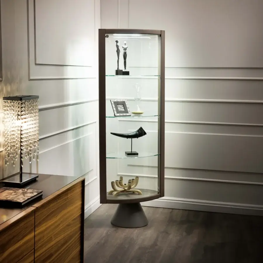 Elegant Cattelan Italia Saba swiveling showcase with fine leather, extra-clear crystal doors and shelves, plus a dark brown wood frame and conical gray steel base