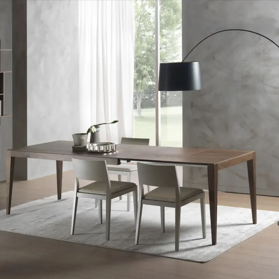 Distinguished Pacini & Cappellini Dominique extendable table with solid ash wood and light-toned finish for a contemporary dining space