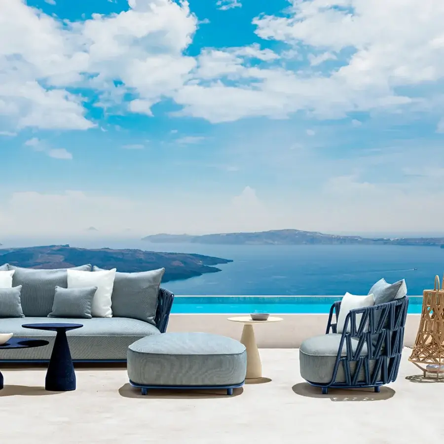 Superior Talenti Swipe sofa with dynamic padded rope weave and light gray textile cushions embracing a dark blue aluminum frame