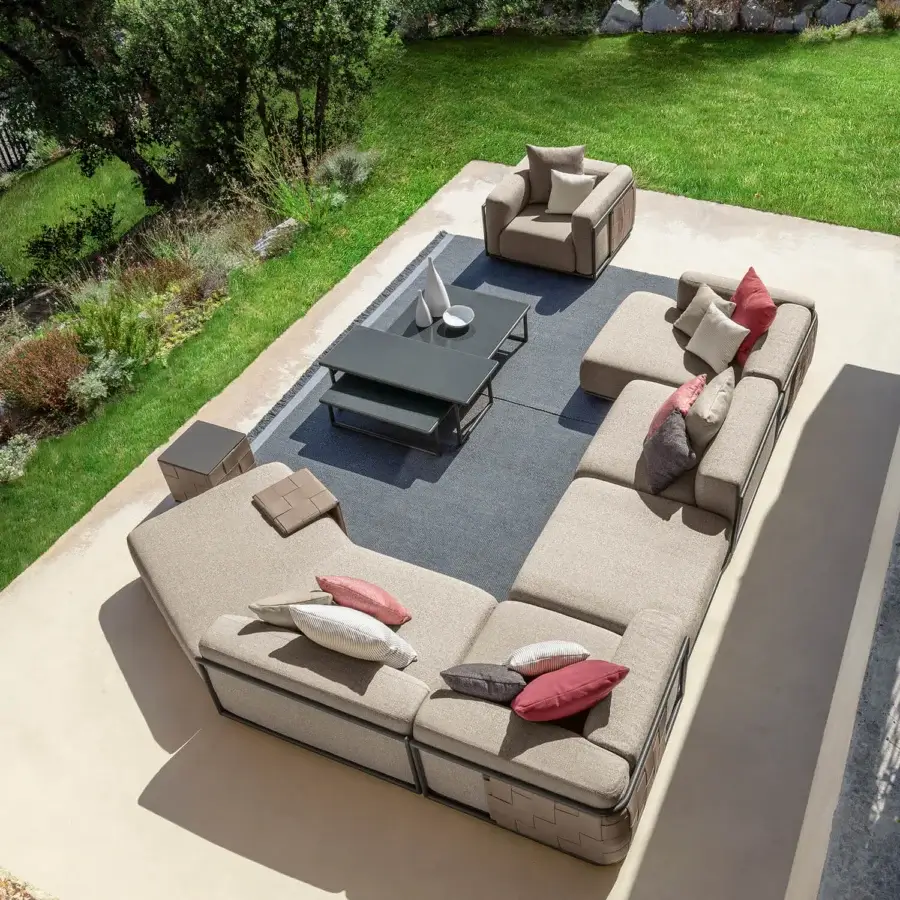 Meticulous Talenti Tressé coffee table with dark gray tubular aluminum structure and hand-crafted glazed lava stone top
