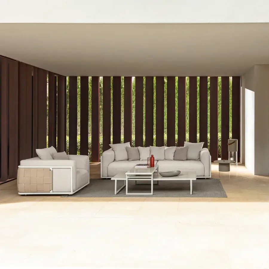 Distinguished Talenti Tressé coffee table crafted with tubular aluminum and hand-crafted glazed lava stone in a light gray matte finish