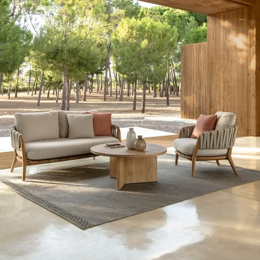 Lavish Talenti Venice lounge chair with solid teak frame and light beige upholstered cushions, accented with woven rope detailing