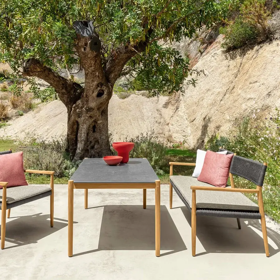 Superior Talenti Dolcevita Wood table with dark gray stoneware tabletop and natural toned teak legs crafted with a matte finish