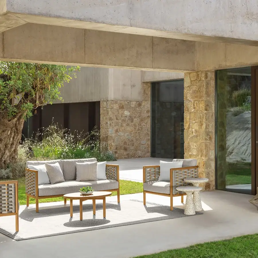 Distinguished Talenti Prichi coffee table crafted in light brown teak with soft lines and a matte finish