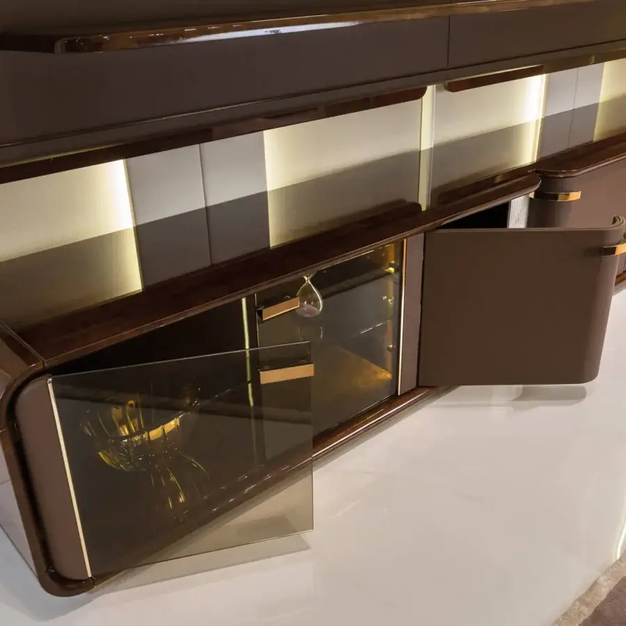 Distinguished Turri Madison TV stand with curved edges, dark brown glossy finish and central marble pillar crafted with gold-tone trim