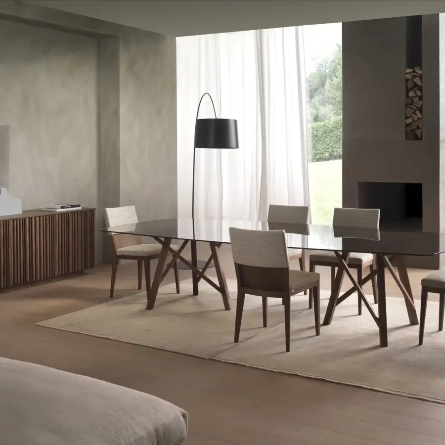 Elegant Pacini & Cappellini Zeus table with transparent tempered glass and matte Canaletto walnut x-shaped legs