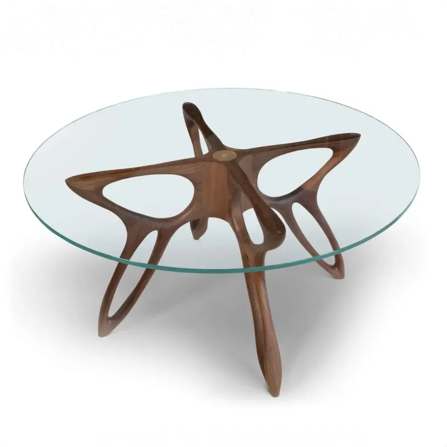 Exceptional BelMondo by Bellotti Ezio Prometeo round table with clear glass and warm medium-toned brown sculpted wooden base