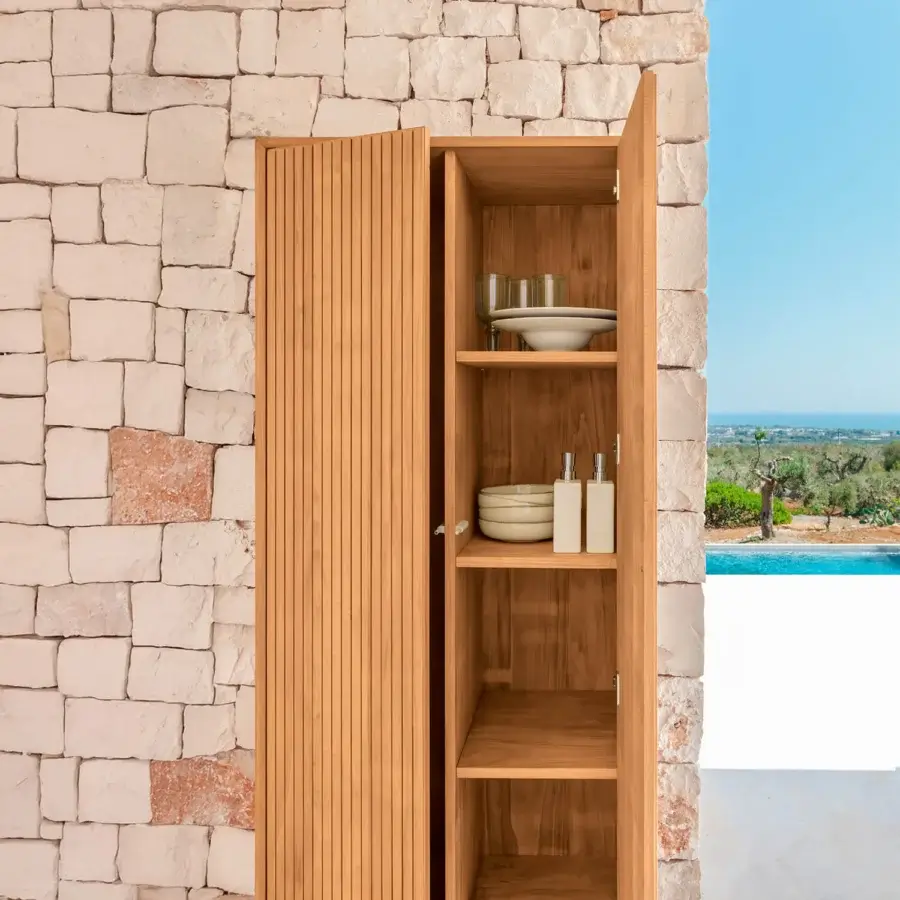 Superior Talenti Chora cupboard crafted in Italy with natural wood and a black metal base exhibiting a vertically grooved finish