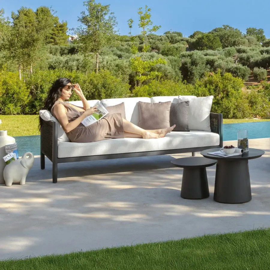 Sophisticated Talenti Dolcevita Alu sofa with a dark aluminum frame and light textile cushions for outdoor relaxation