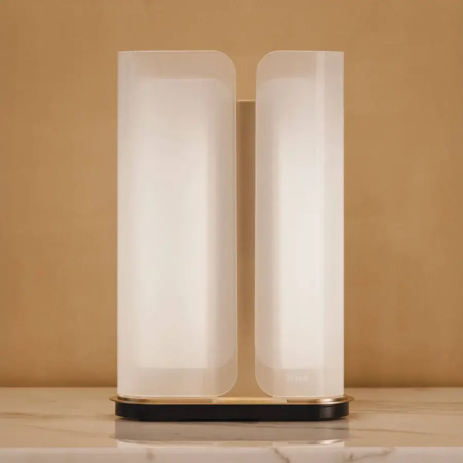 Exceptional Turri Madison table lamp with opaque white glass sections and satin metal structure built with a black and gold base