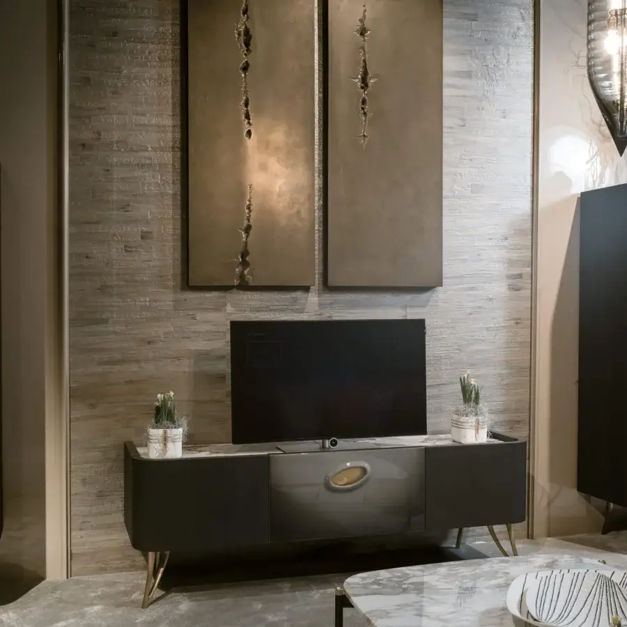 Distinguished Bellotti Ezio Pangea TV stand with matte dark gray and glossy light gray sections crafted in a marble-patterned top with gold-toned legs