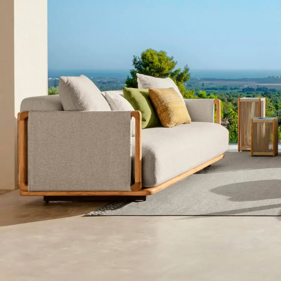 Exceptional Talenti Jun sofa with warm teak and light gray textured textile upholstery, lifted by wooden legs with accent pillows