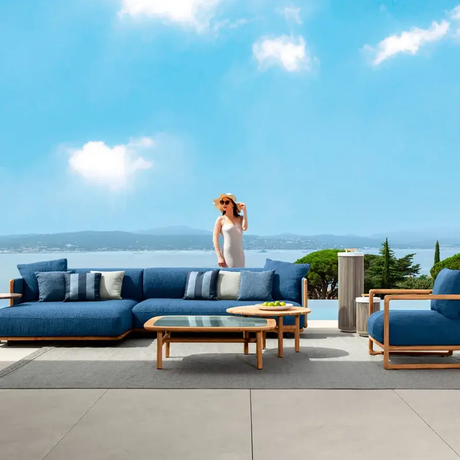 Harmonious Talenti Jun lounge chair with solid teak wood frame and refreshing blue textile upholstery exhibiting a natural finish