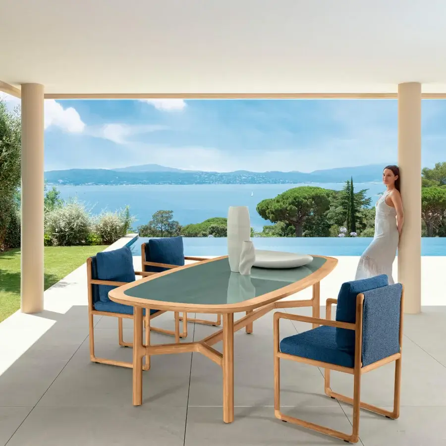 Distinguished Talenti Jun armchair with cozy blue textile and warm solid teak wood frame crafted in Italy