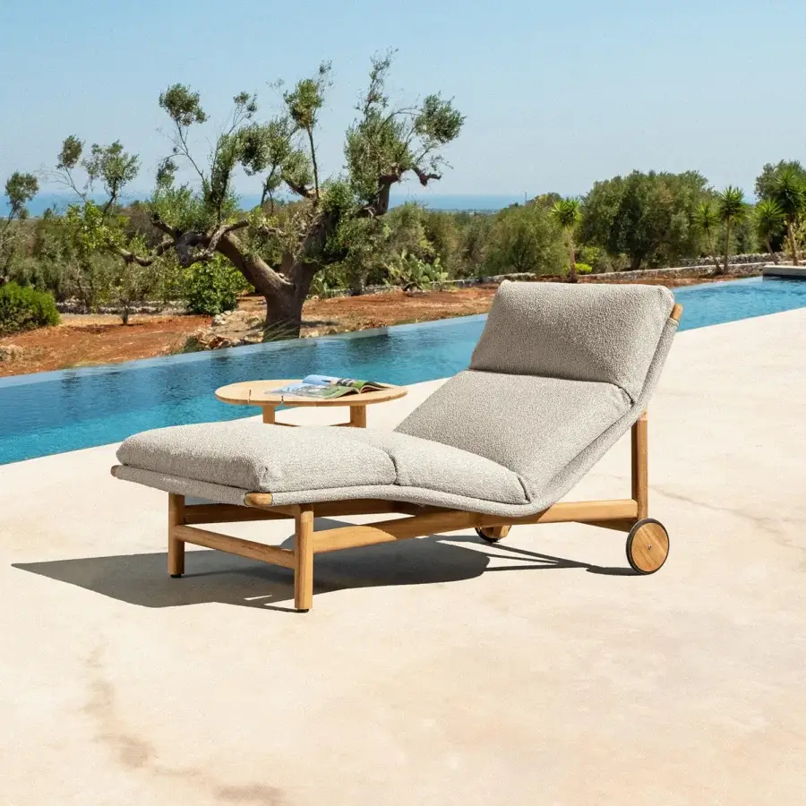 Exceptional Talenti Jun lounger crafted in Italy with plush bouclé fabric and a strong wooden frame offering effortless mobility