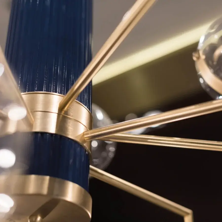 Exclusive Turri Madison lamp with transparent illuminated spheres and a deep blue fluted column built with satin golden metal arms