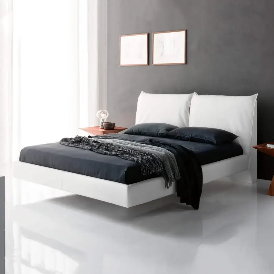 Sophisticated Cattelan Italia Lukas bed with smooth white synthetic leather upholstery and sleek chromed steel feet