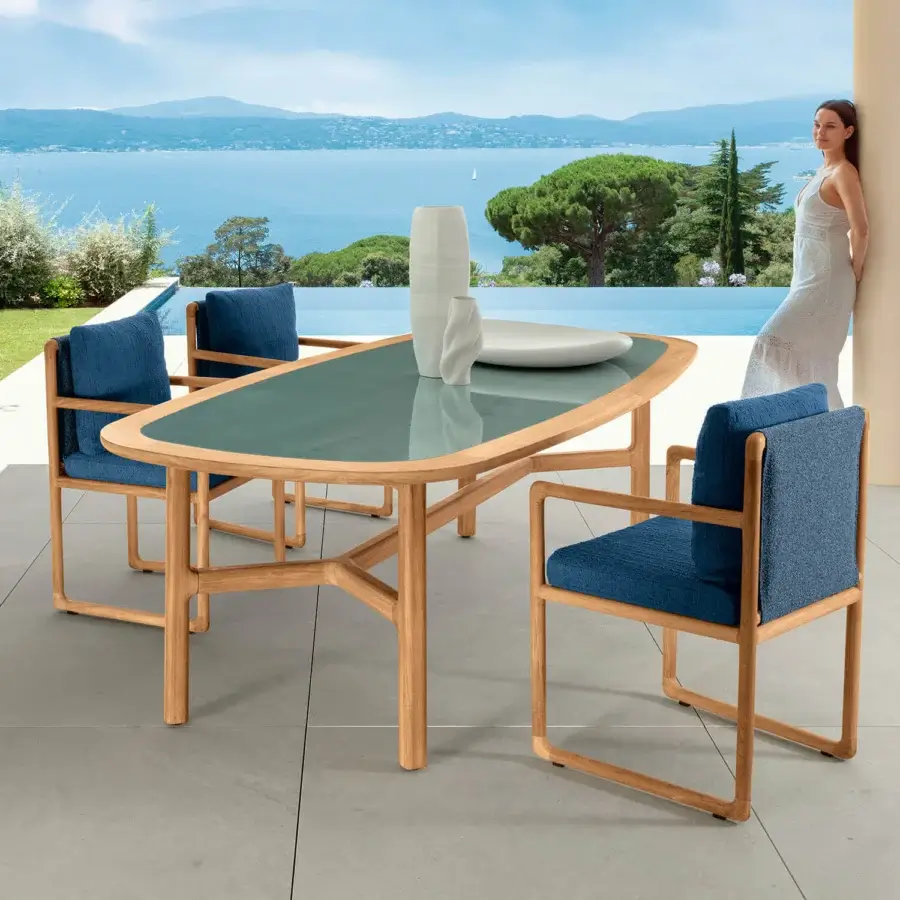 Refined Talenti Jun table with gres top and natural teak structure exhibiting a glossy greenish-grey hue