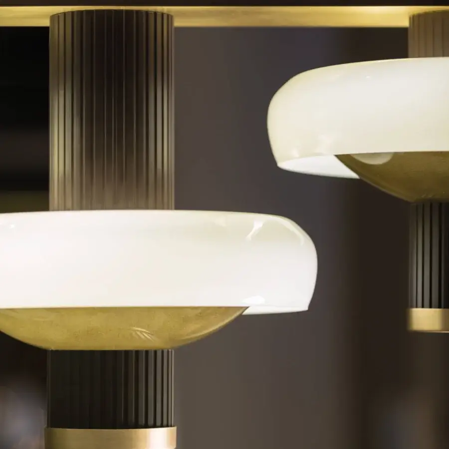 Sophisticated Turri Claire suspension lamp with extruded metal columns and a white glass disc in dark bronze finish