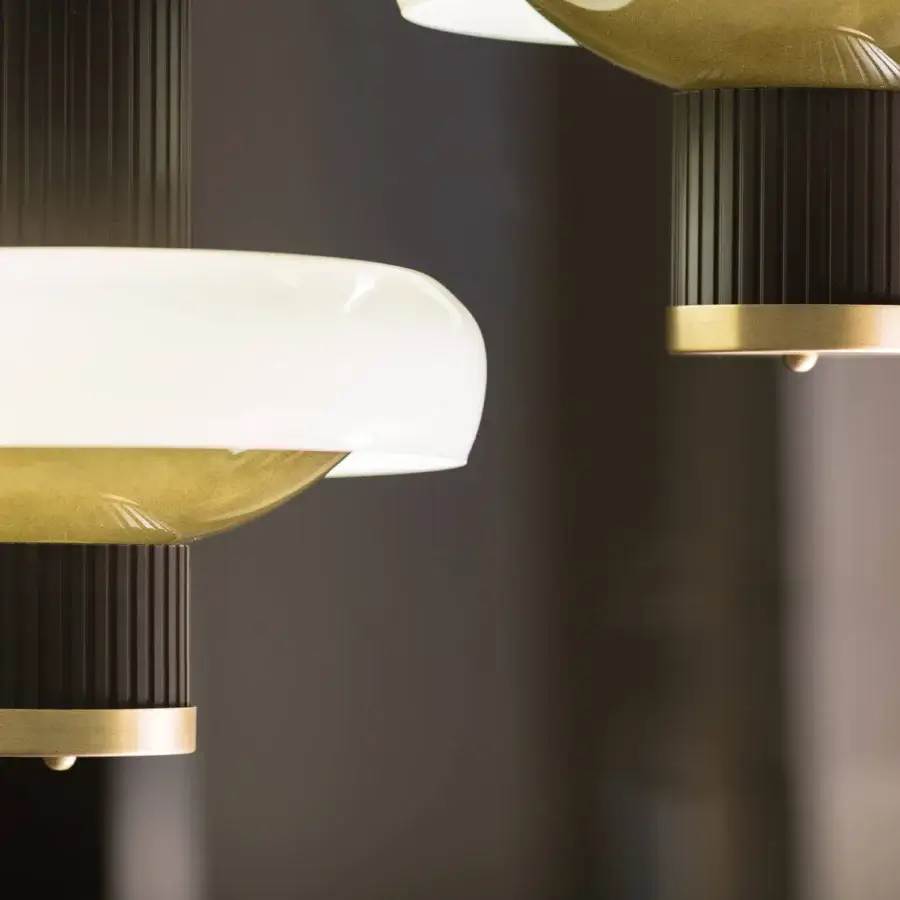 Distinguished Turri Claire suspension lamp with dark brown metal columns holding bronze and white glass discs in glossy finish
