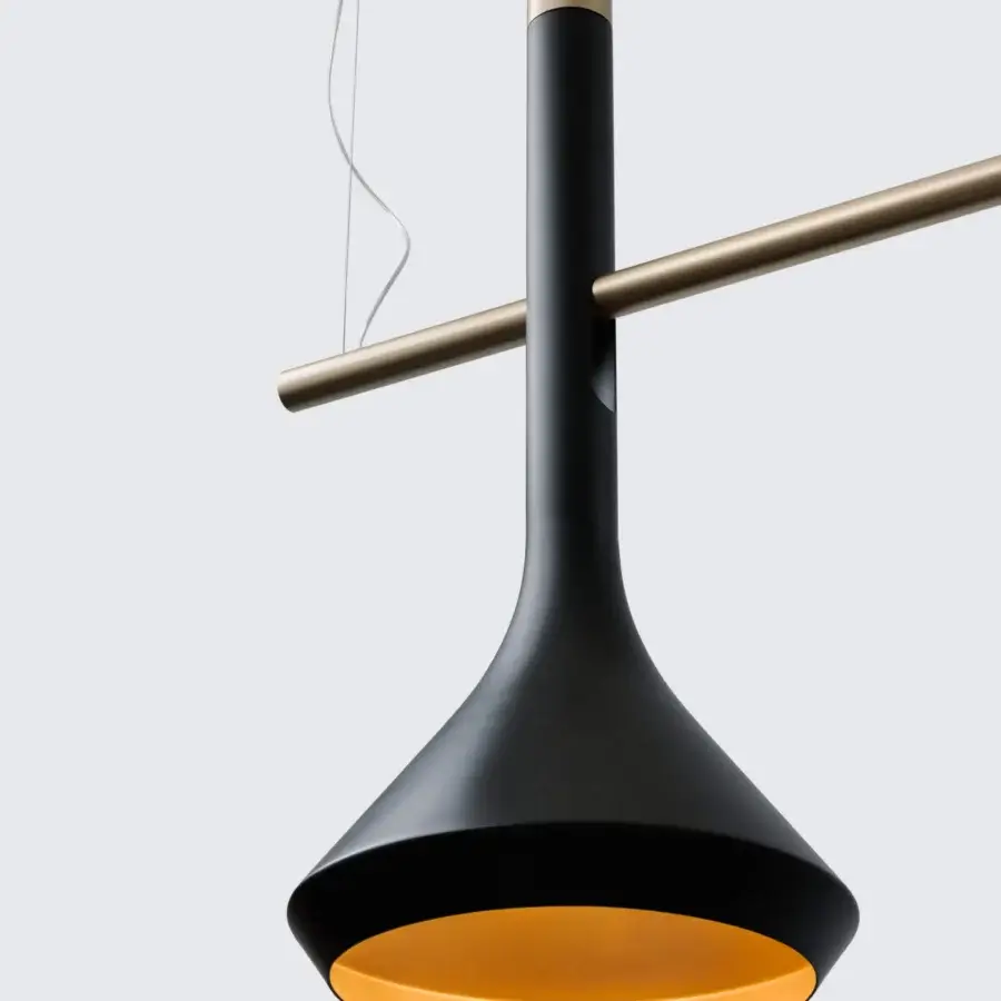 Distinguished Turri Tubular Bells suspension lamp crafted in metal with black matte exterior and golden interior finish
